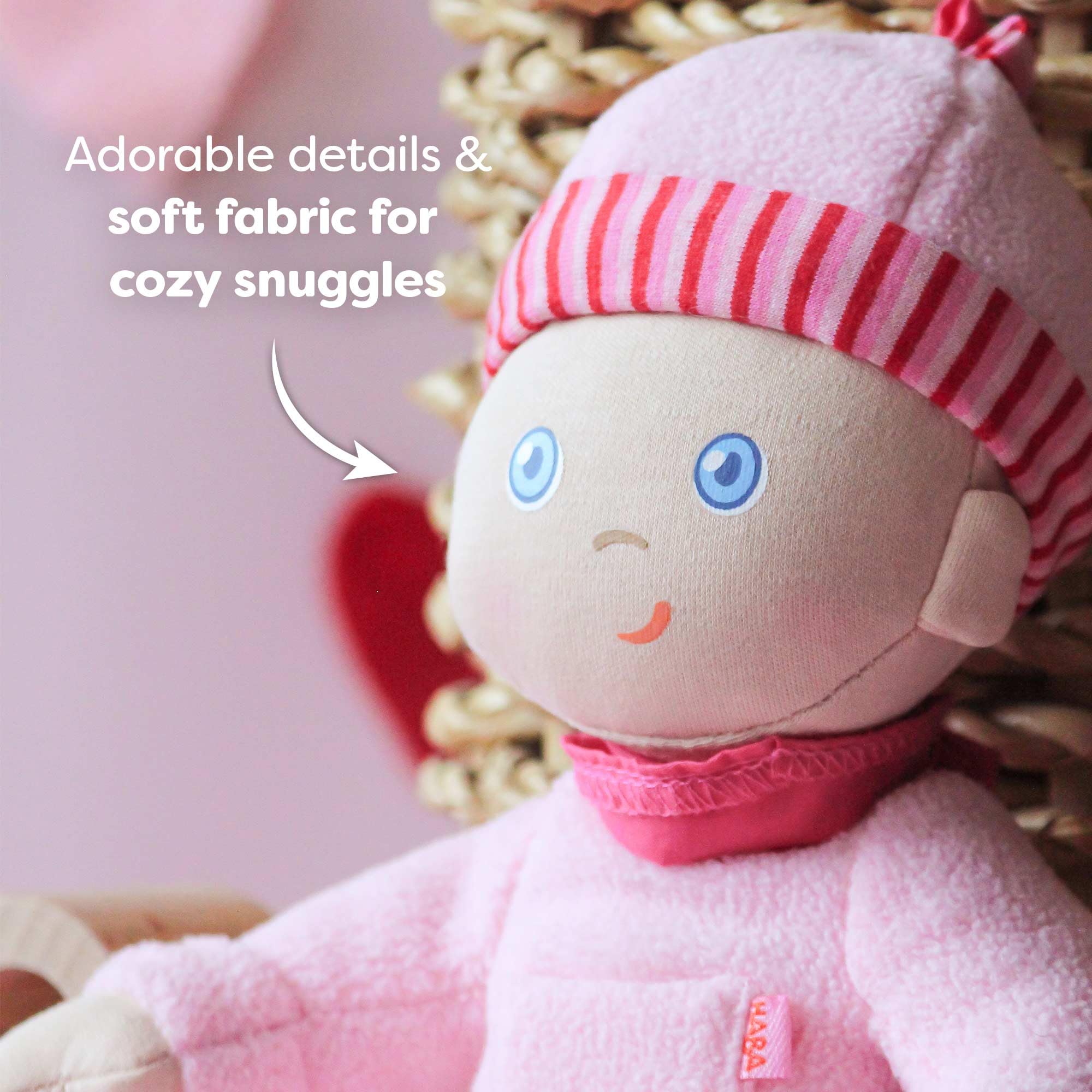 HABA Luisa newborn-safe design with printed facial features for gentle play.