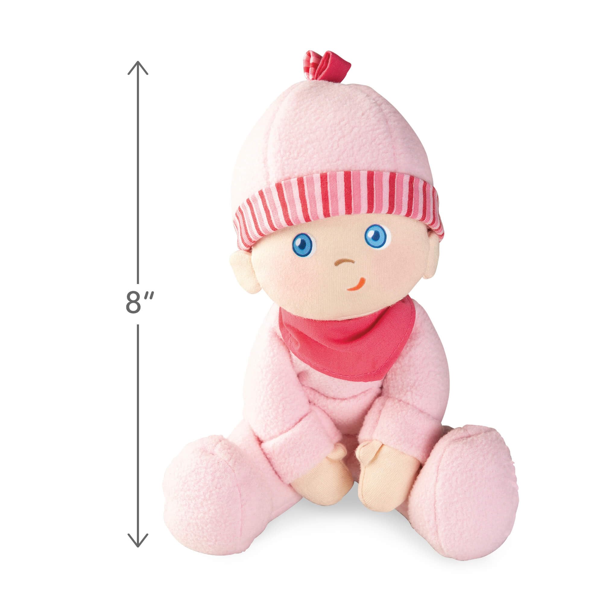 Close-up of HABA Luisa's soft plush face inviting tactile exploration.