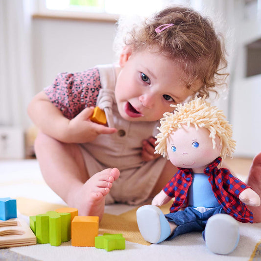 HABA Nick 12-inch doll blue eyes close-up highlighting vivid detail for storytelling.
