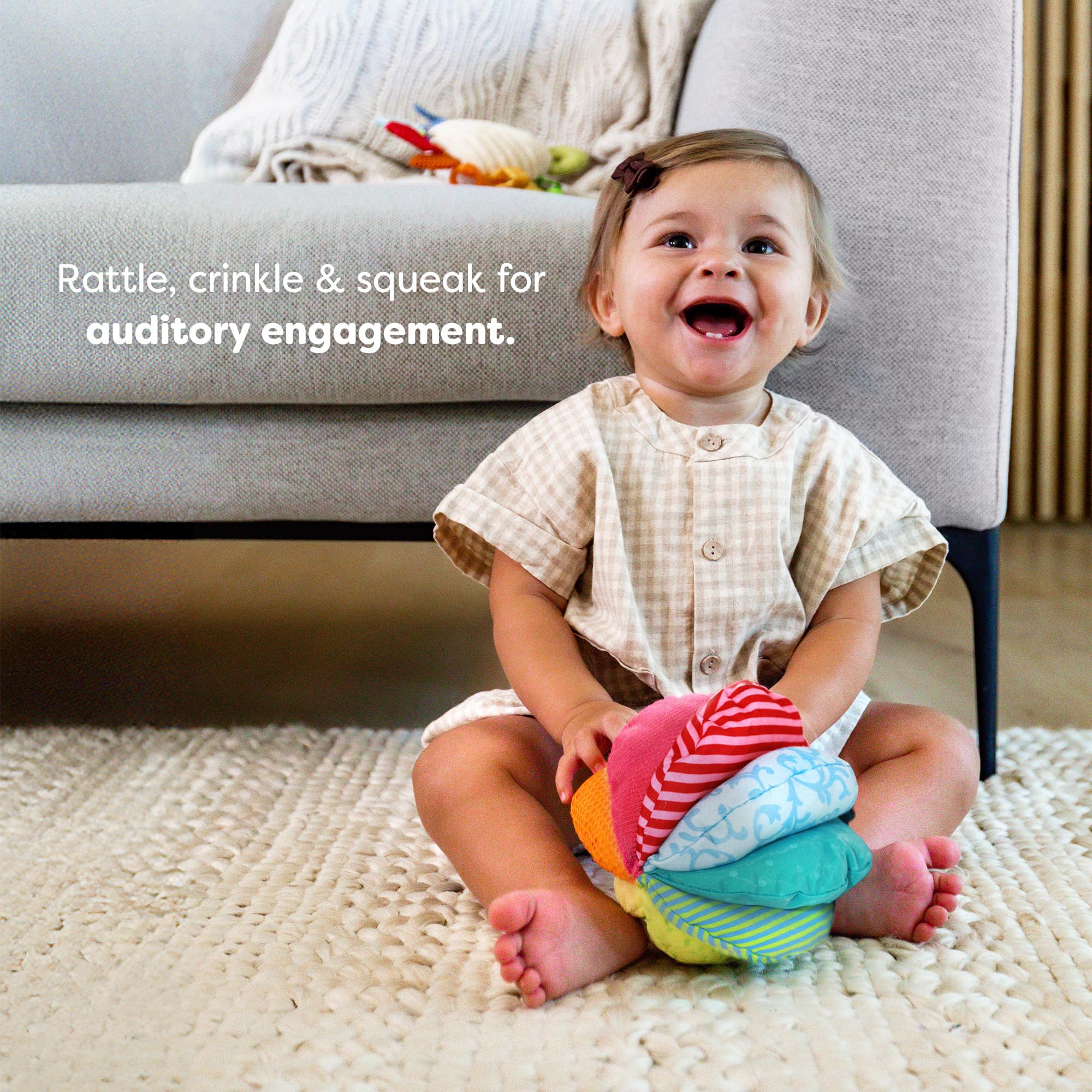 HABA Rainbow Baby Ball crinkle panels encourage grasping and fine motor practice.