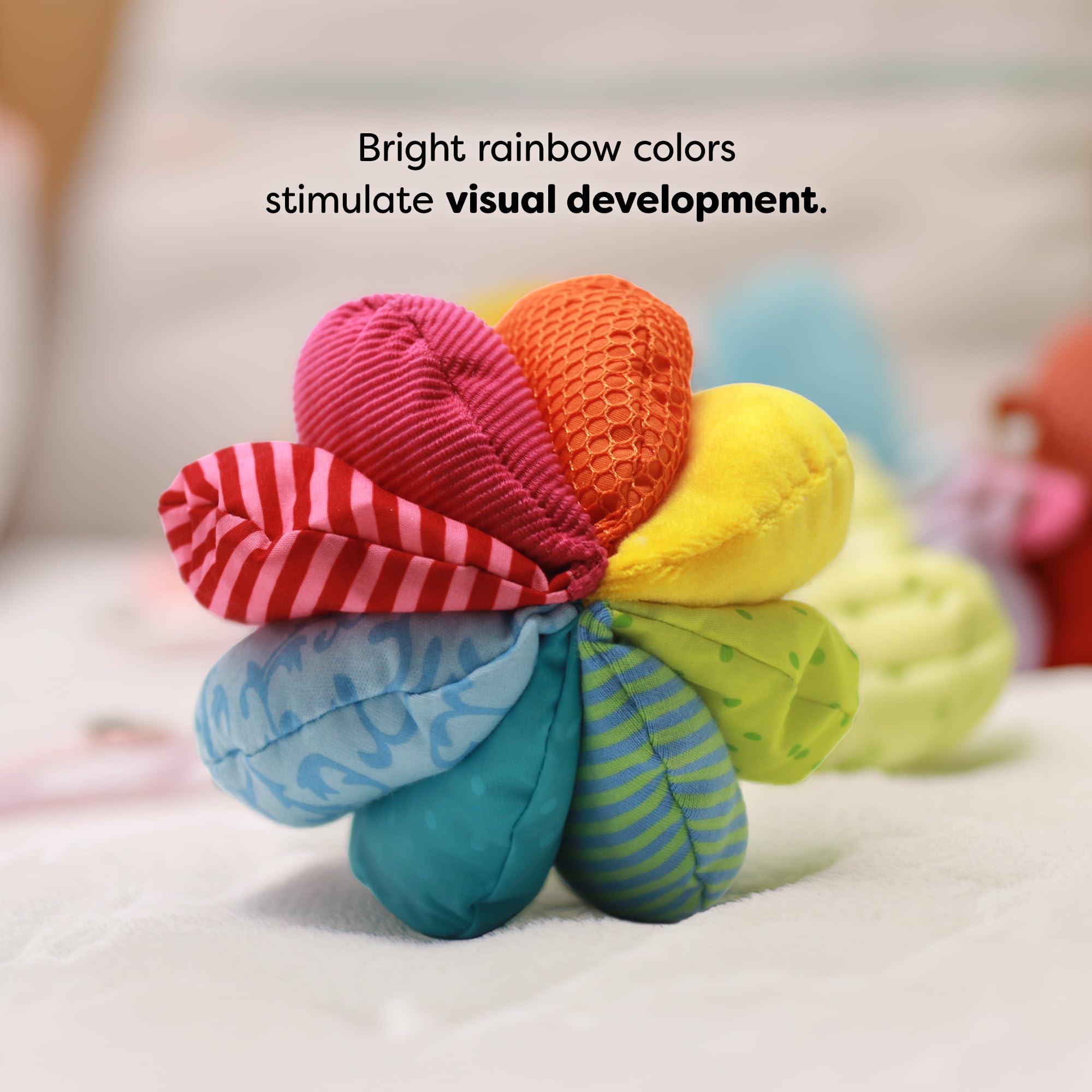 HABA Rainbow Baby Ball soft fabric cover provides safe, cozy play for babies.