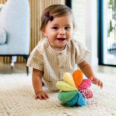 HABA Rainbow Baby Ball tummy-time companion promotes gentle exploration and coordination.