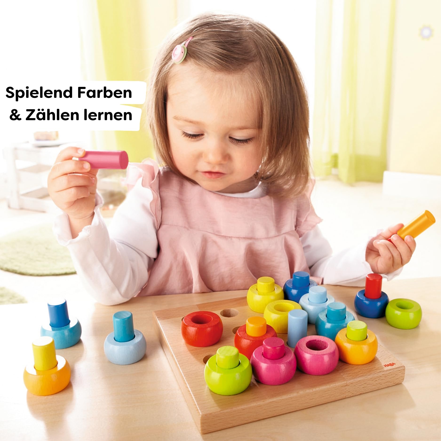 HABA Rainbow Whirls rings collection, vibrant colors for color sorting and pattern exploration.