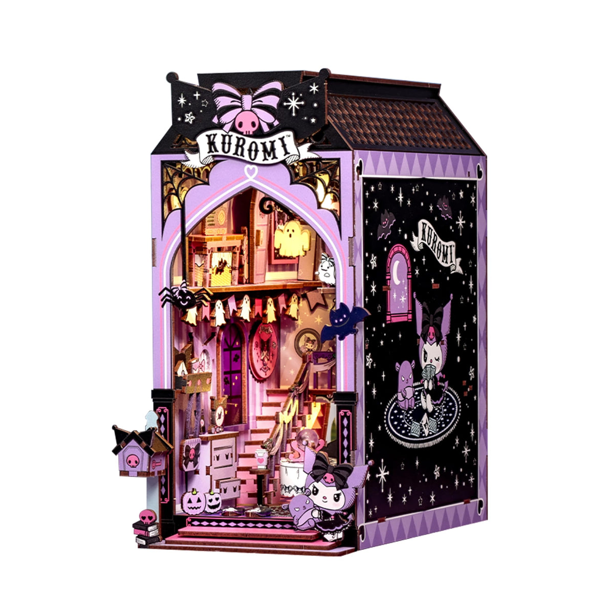 Hands Craft Kuromi spooky house cover ready for creative assembly on a bookshelf