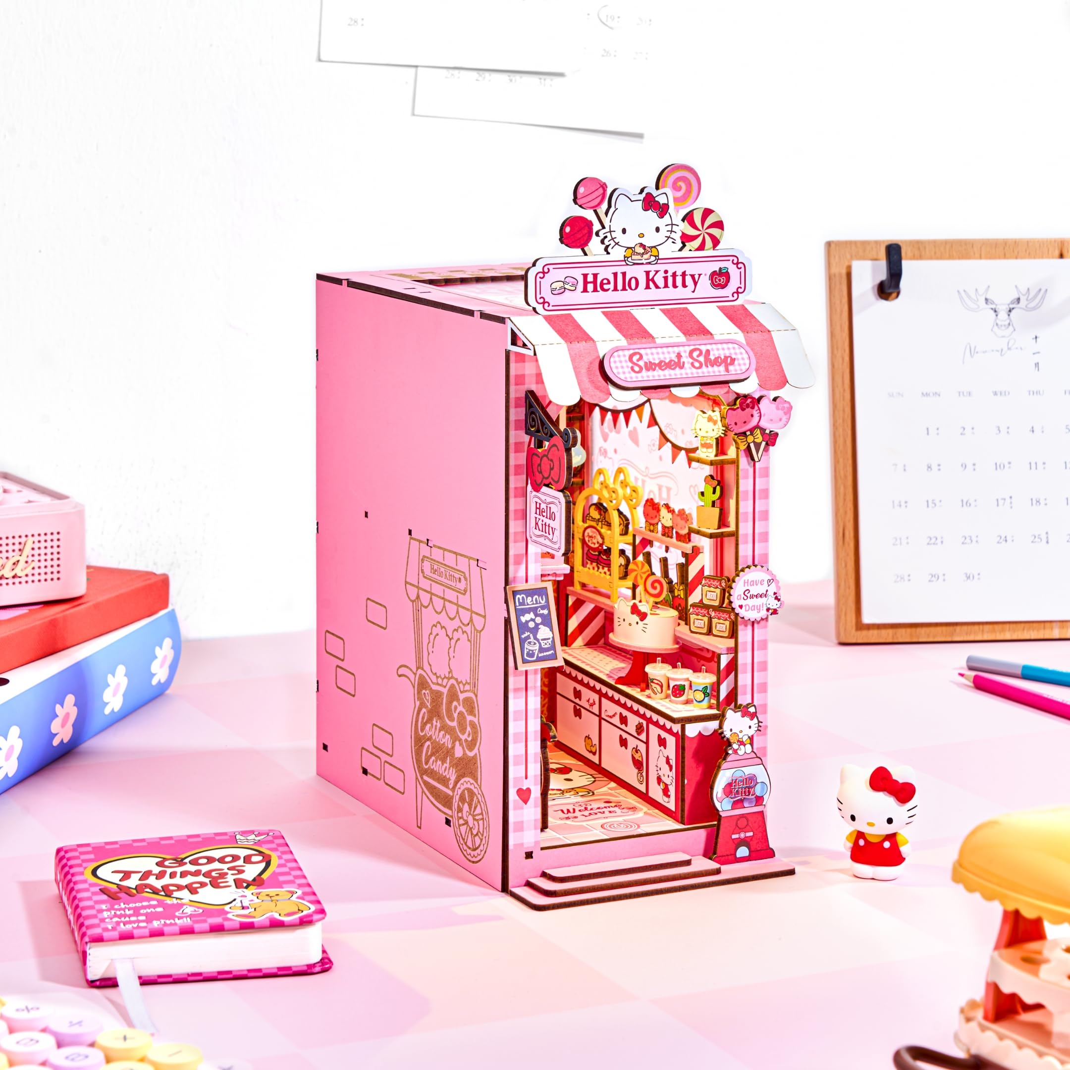 Hands Craft striped awning detail adds charm to Hello Kitty diorama.