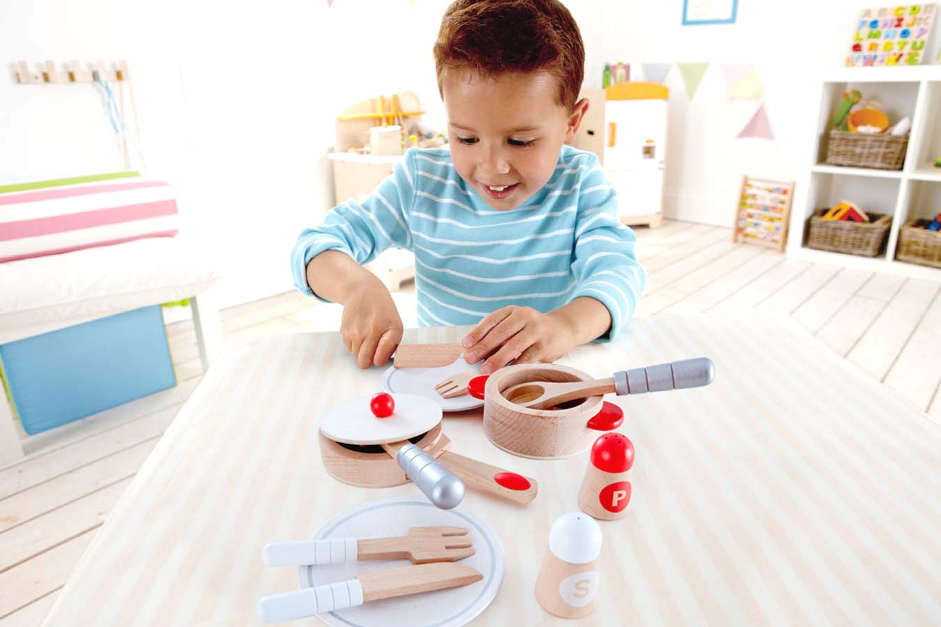 Hape Cook and Serve Set plates and cutlery encourage sharing and storytelling.