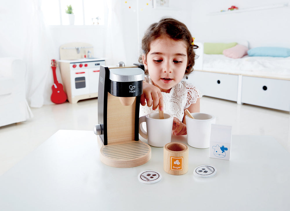 Hape wooden coffee maker with mugs supports family role-play during breakfast.