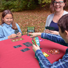 Happy Camper Trio emphasizes memory and luck in engaging rounds.