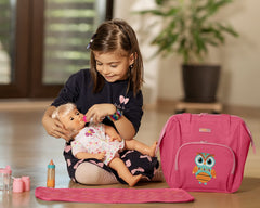 HappyVk child playing with the doll diaper bag during pretend play