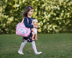 HappyVk soft-pink fabric and handles offer a cozy feel for daily adventures