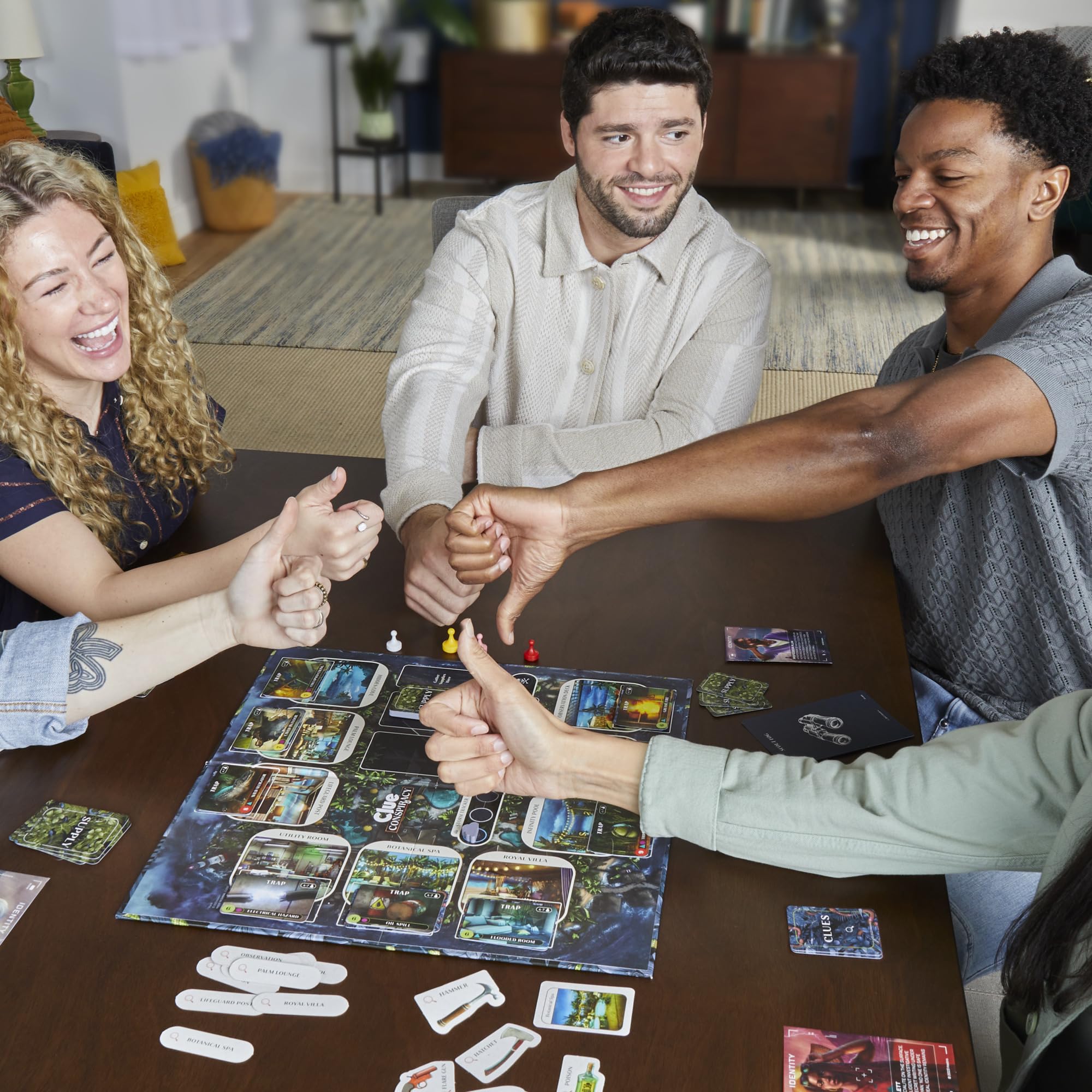 Hasbro Clue Conspiracy player tiles support team-based bluffing and alliance tracking.