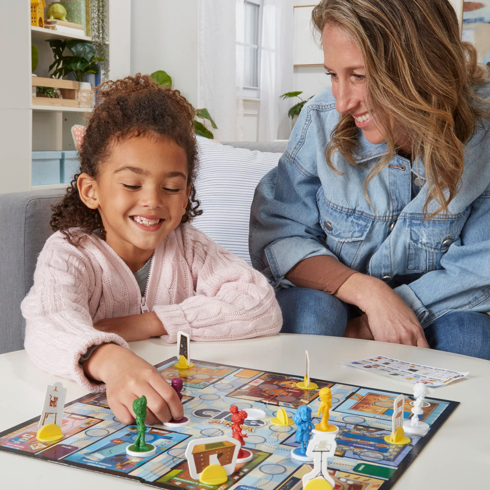 Hasbro Gaming Clue Junior seek-and-find tiles showcase visual clues that spark observation.