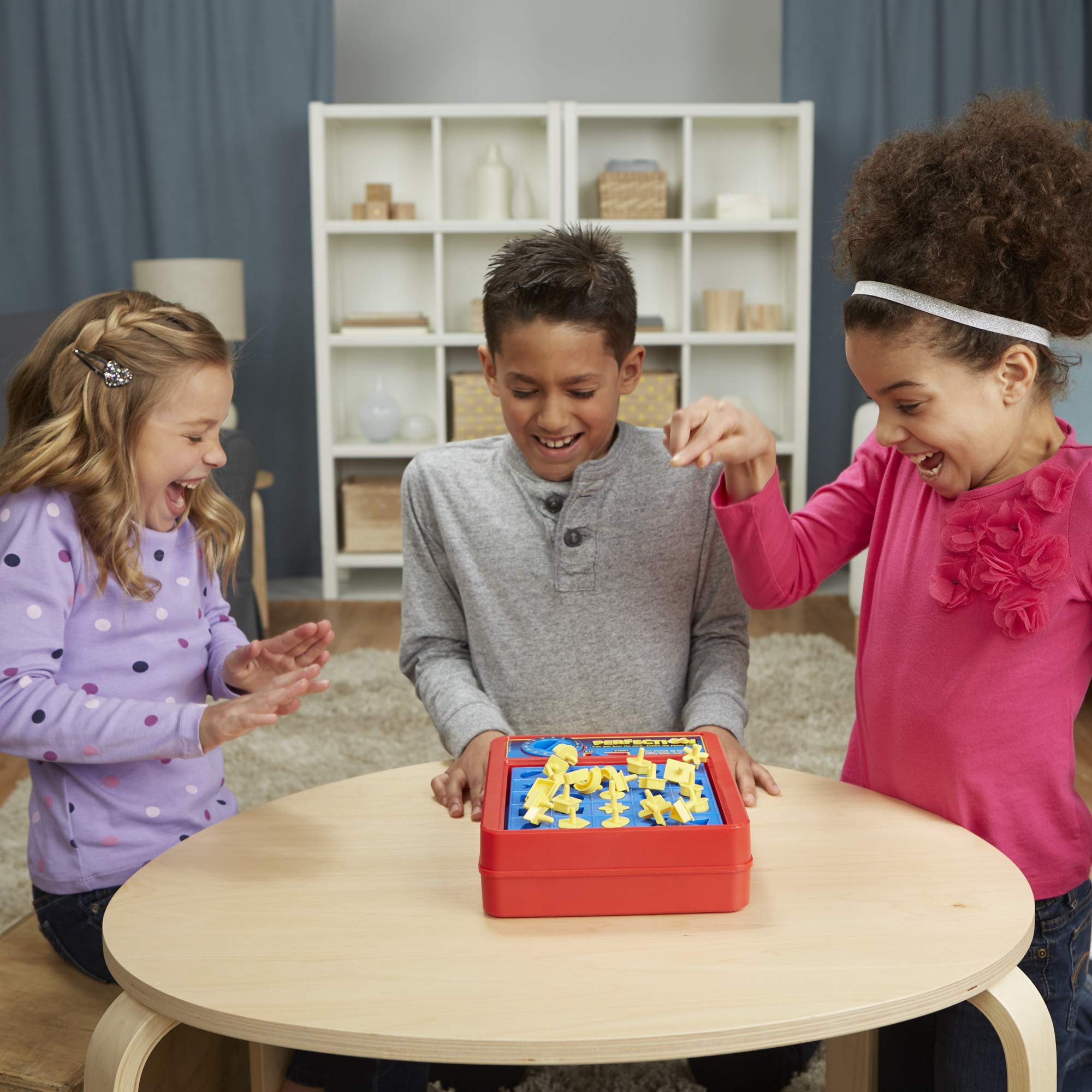 Hasbro Gaming Perfection storage unit keeps all pieces neatly stored after games