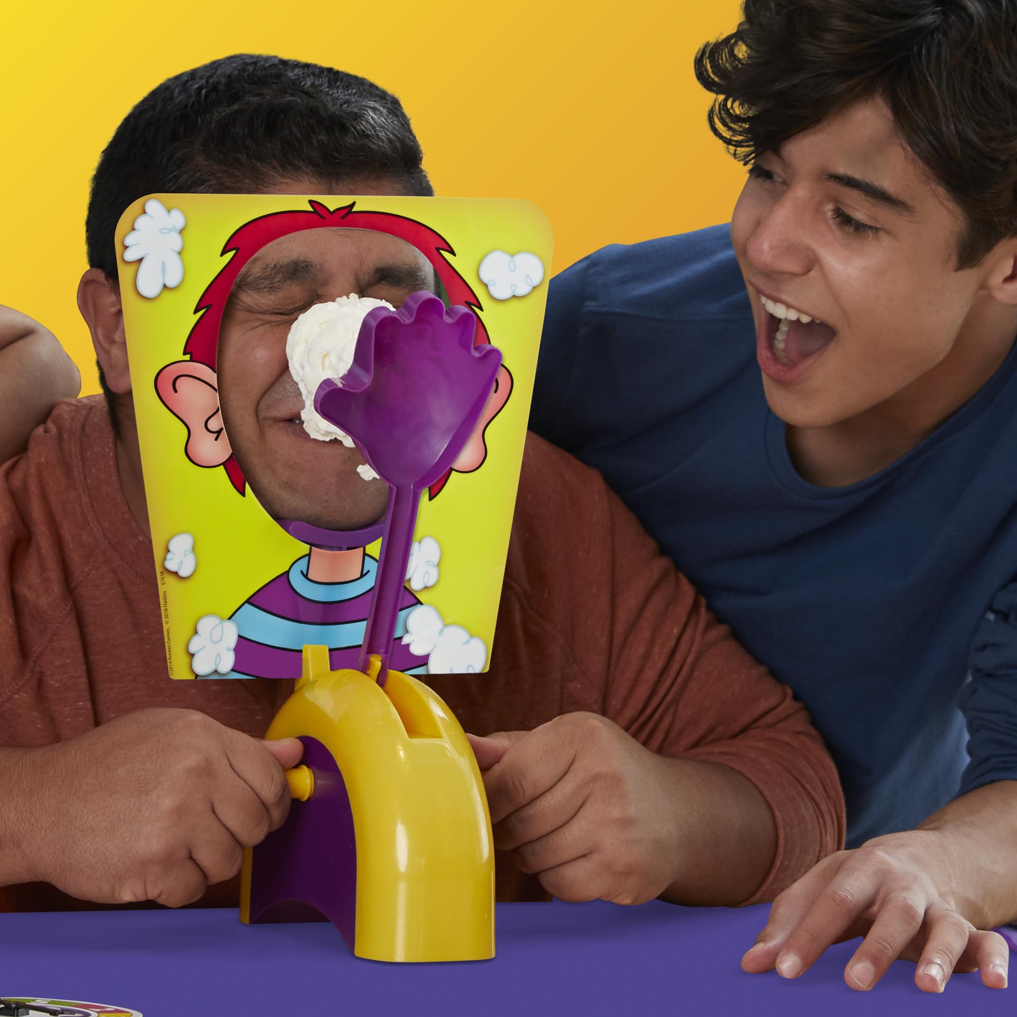 Hasbro Gaming Pie Face Game scoring points, encourages careful turns.