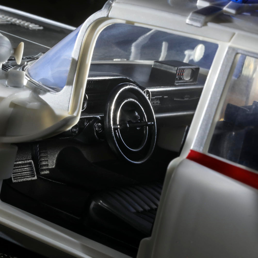 Hasbro Ghostbusters Ecto-1 1984 rolling wheels for dynamic display.