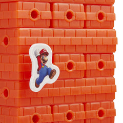 Hasbro Jenga: Super Mario Edition pegs—precise placement challenges players.