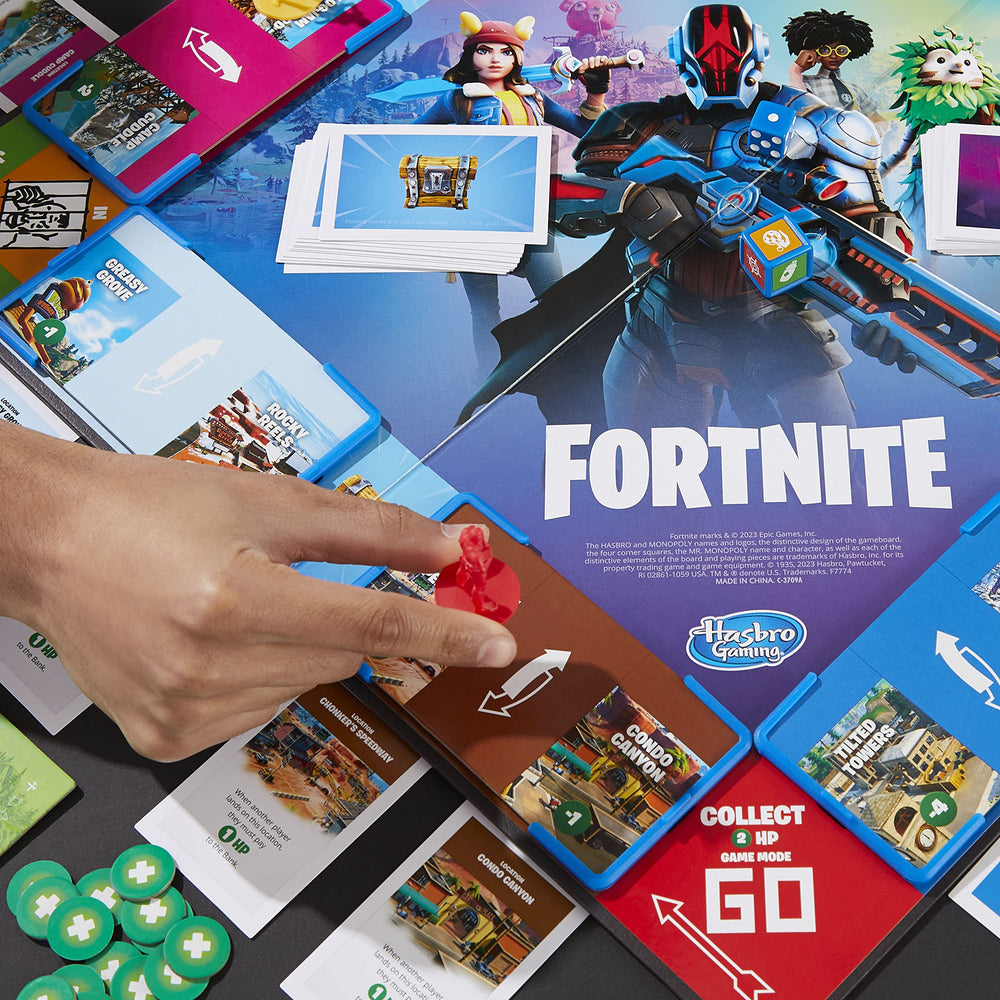 Hasbro Monopoly Flip Edition Action die boosts HP and targets opponents.