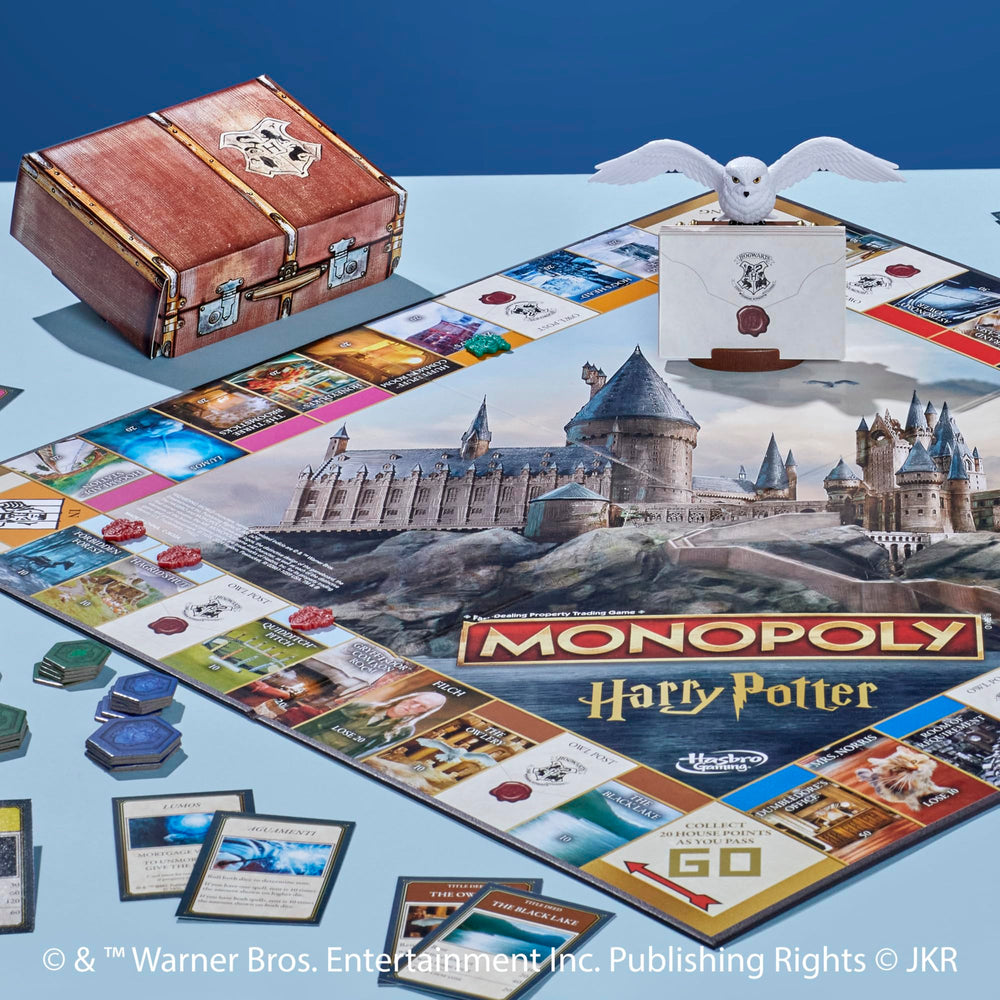 Six golden tokens evoke magical transport in Hasbro Monopoly Harry Potter Edition.