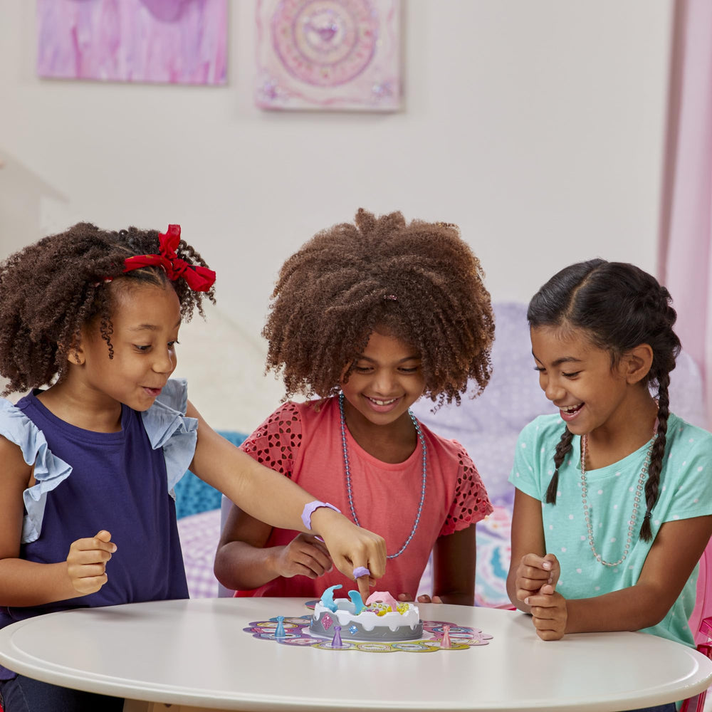 Hasbro Pretty Pretty Princess jewelry pieces sparkle on the table during play.