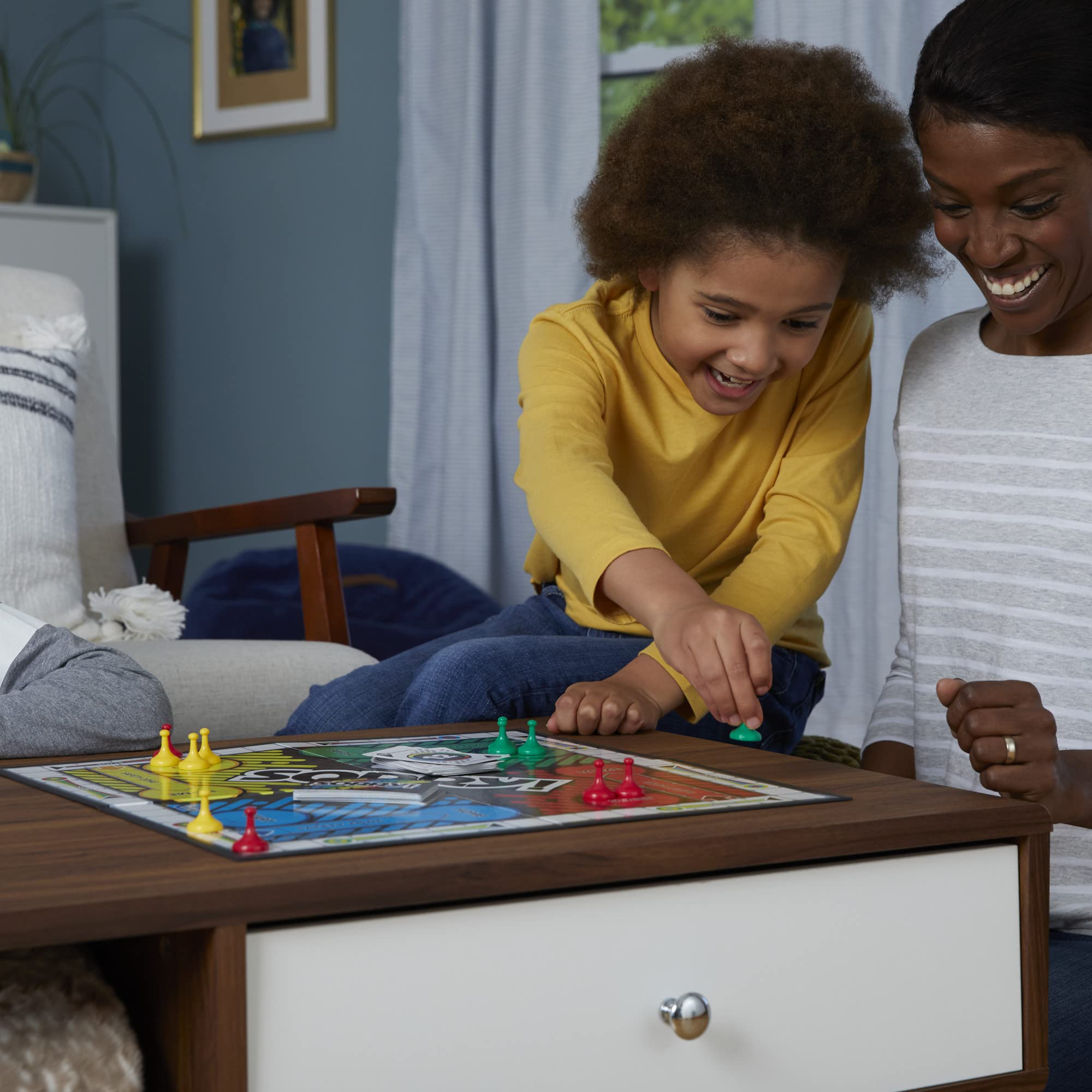 Hasbro Gaming Sorry! family playing in living room demonstrating fun group interaction
