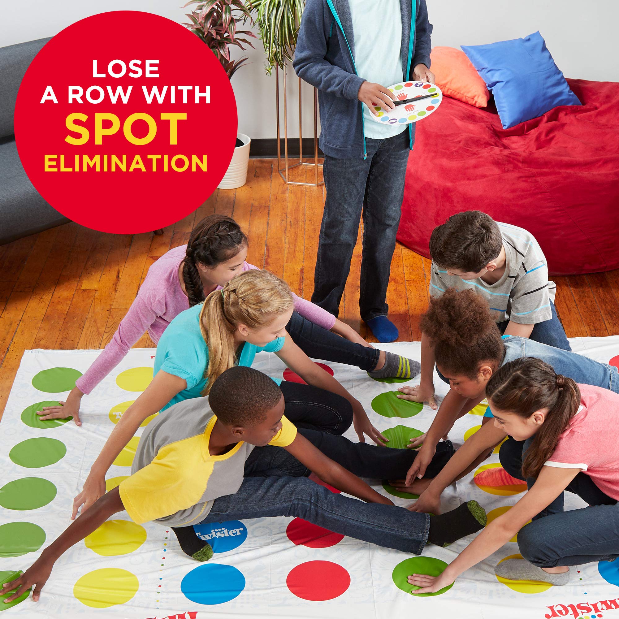 Hasbro Twister Ultimate play area laid out on a smooth floor.