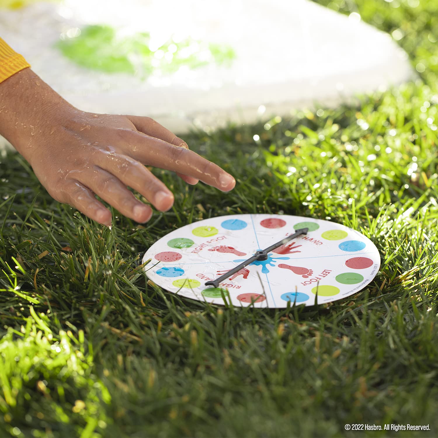 Hasbro Twister Ultimate Splash spouts water from spots for refreshing play.