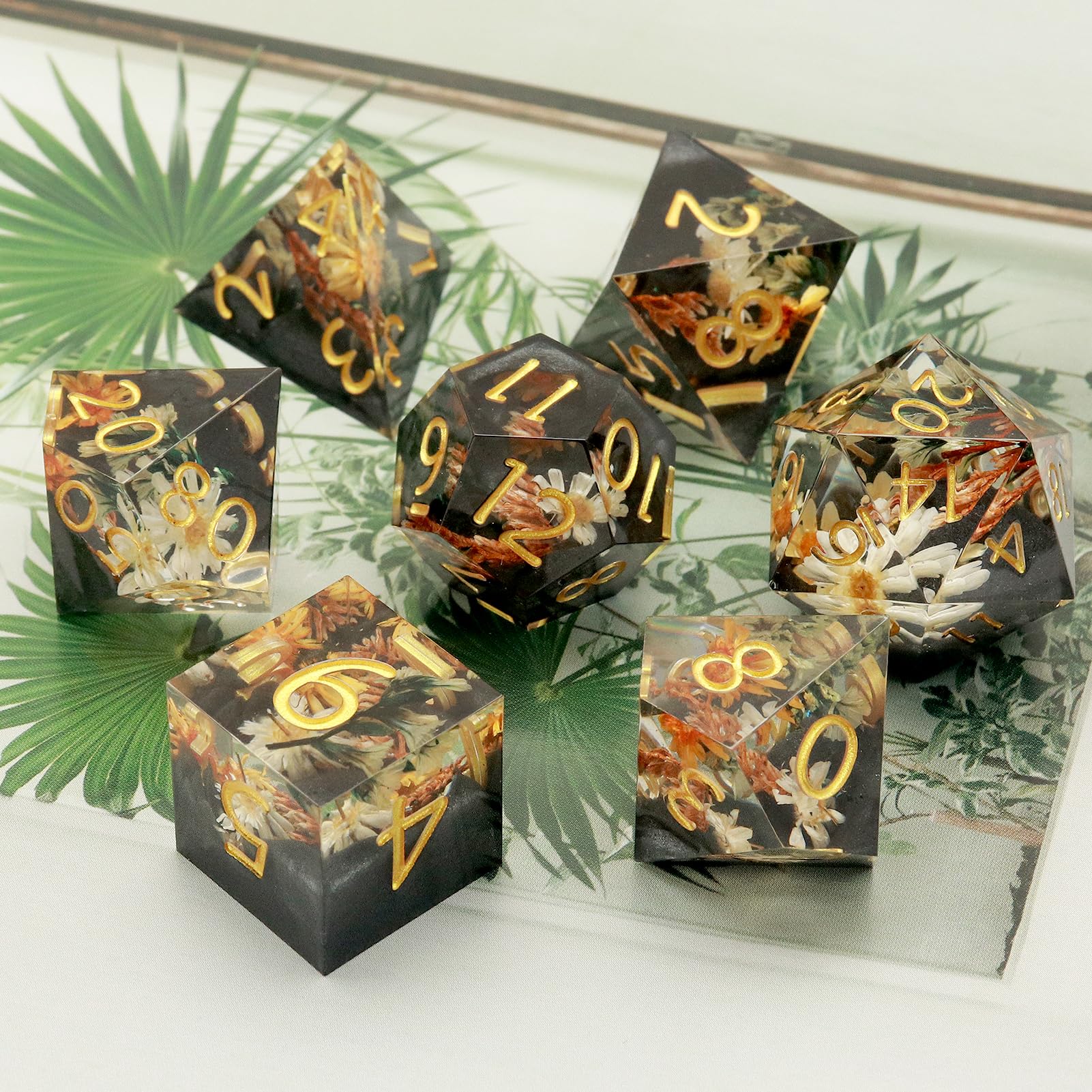 Haxtec metal dice box keeps the set safe and organized.
