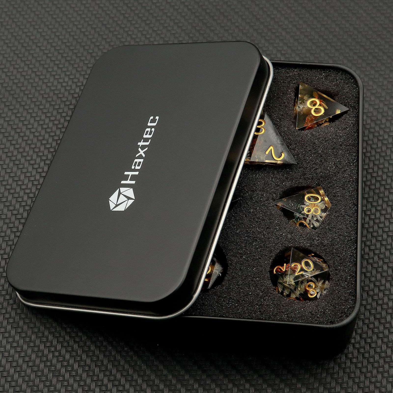 Haxtec sharp-edge resin D4 dice for quick outcome reads.