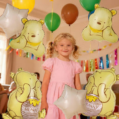 Heboland Pooh photo-friendly balloons frame cute nursery moments.