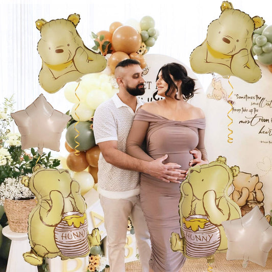 Heboland Pooh honey pot foil balloon enhances birthday party décor.
