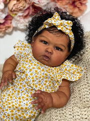 Hengluck open-eyes reborn doll displays realistic face and expressive gaze.