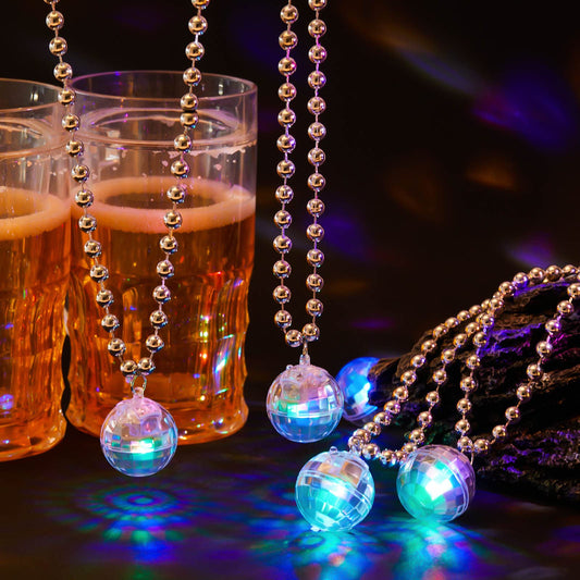 Henoyso disco ball necklaces with wearable-light effects for nighttime celebrations.
