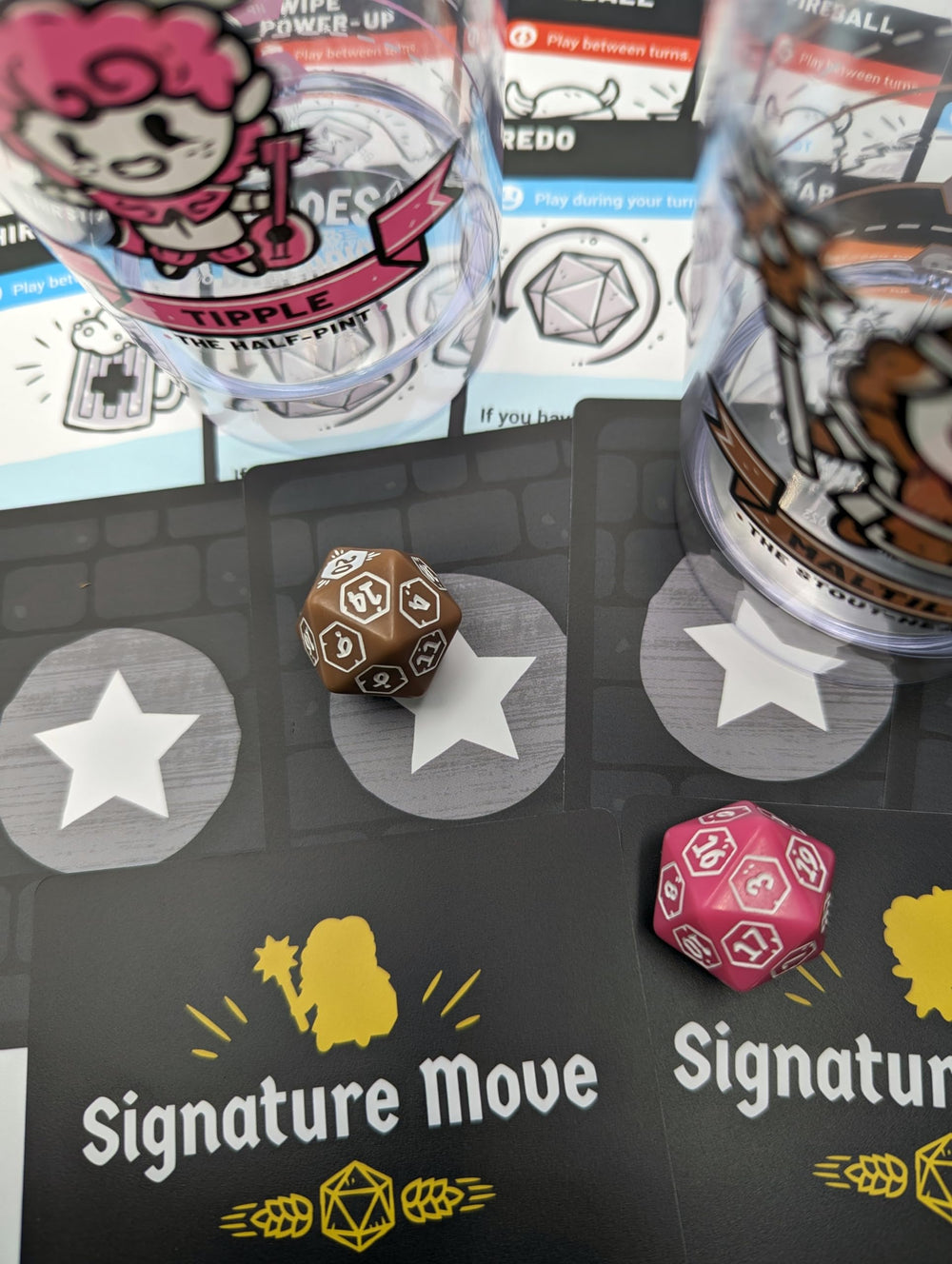 Two signature move cards showcase unique abilities for Rollacrit's heroes.
