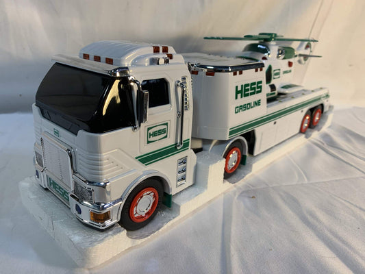 Hess 2006 flatbed trailer supports hauling action for kids' games.
