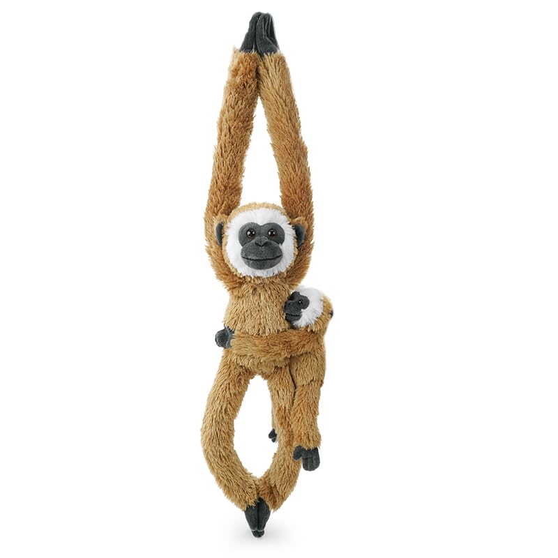 Hideekoog monkey hanging on Christmas tree, a playful seasonal accent.