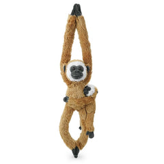 Hideekoog monkey hanging on Christmas tree, a playful seasonal accent.