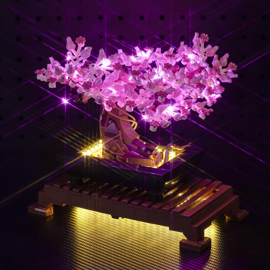 Hilighting LED light kit on bonsai tree assembly enhances display with subtle illumination.