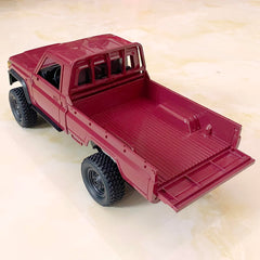 HLSFWDRIVE MN82 RC Rock Crawler side view highlights scale and durable chassis for rugged terrain