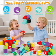 Kids building colorful foam magnetic structures with Hodurgyi blocks.