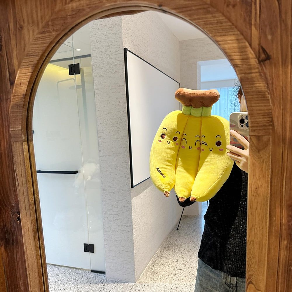 Hofun4U banana plush pillow in a kid's bedroom as a playful decor accent