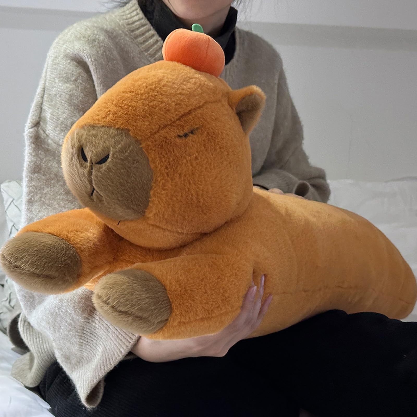 Hofun4U capybara plush resting on a bed for long-body comfort.