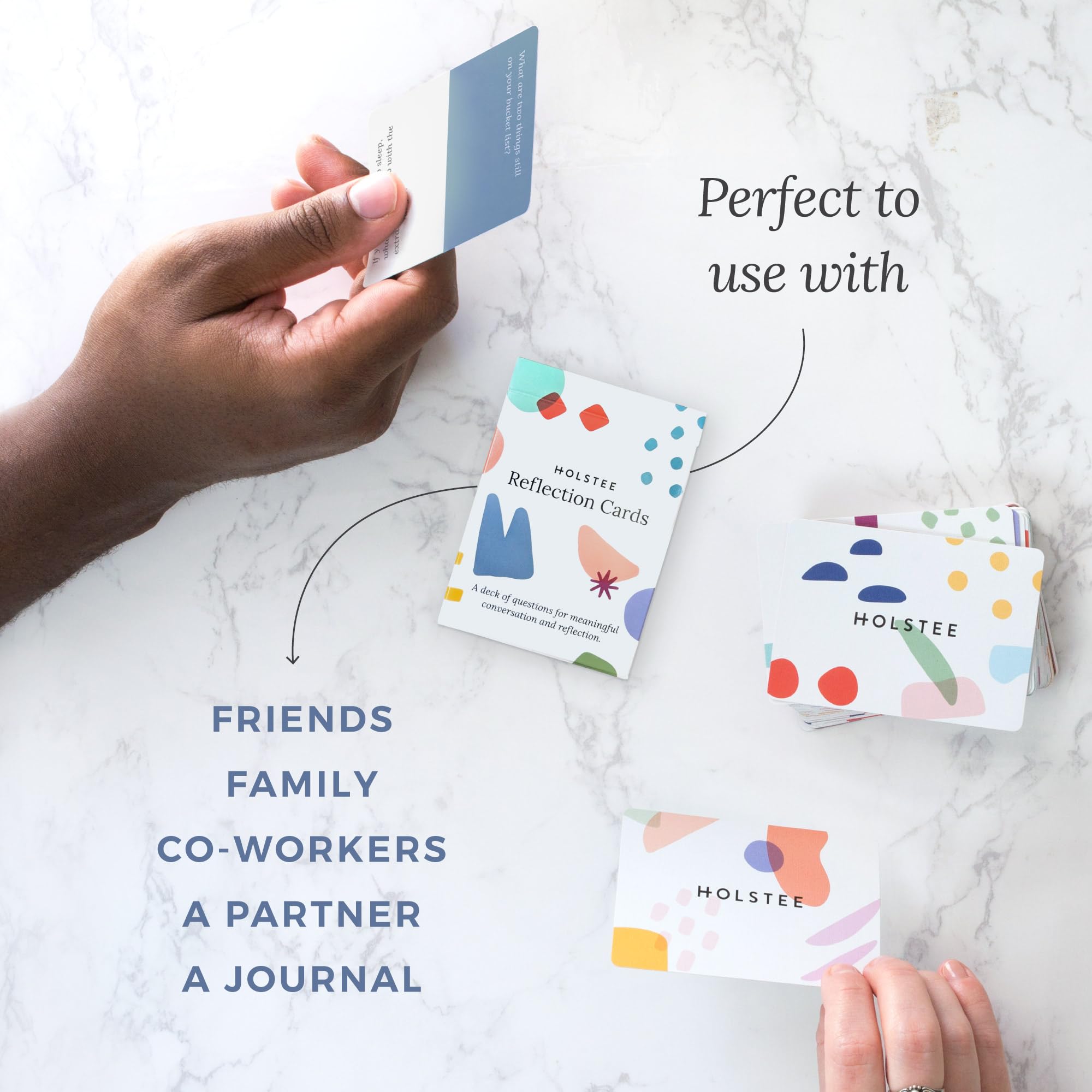 Holstee Reflection Cards pack resting beside a cozy coffee moment.