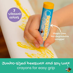 Child drawing with Honeysticks crayons during a playful tub session.