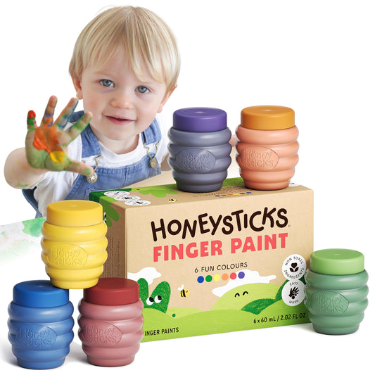 Honeysticks finger paints in six bright colors on pots for early color exploration