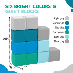 Hoohtoot giant blocks on a playroom floor encouraging safe, imaginative building.
