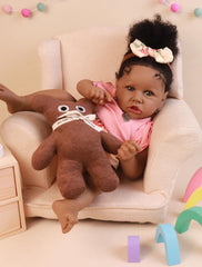 HOOMAI African American reborn doll close-up showing blue eyes and lifelike expression.