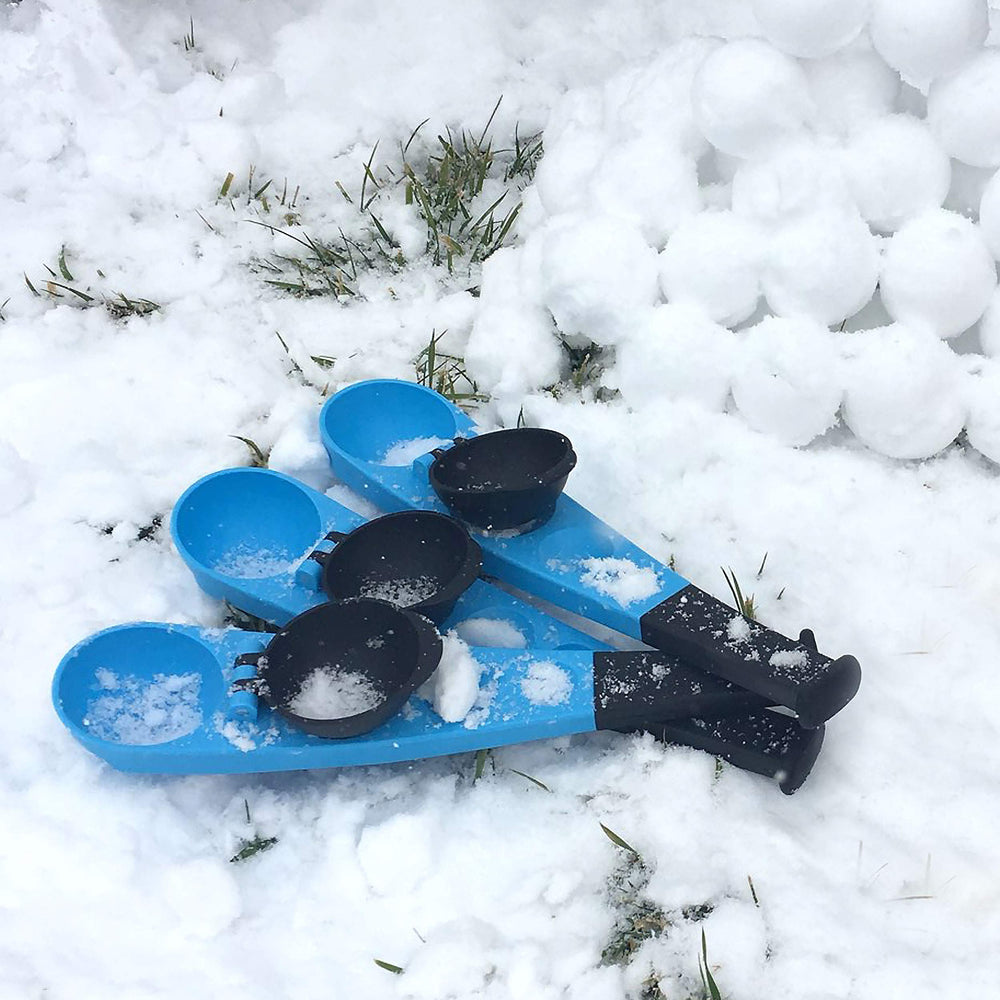 Hoopla Toys snowball thrower in a snowy backyard scene