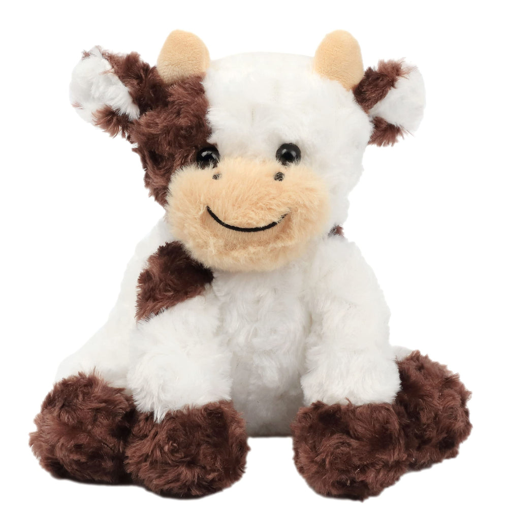 Hopearl cow stuffed animal on a bedside table as decorative piece.