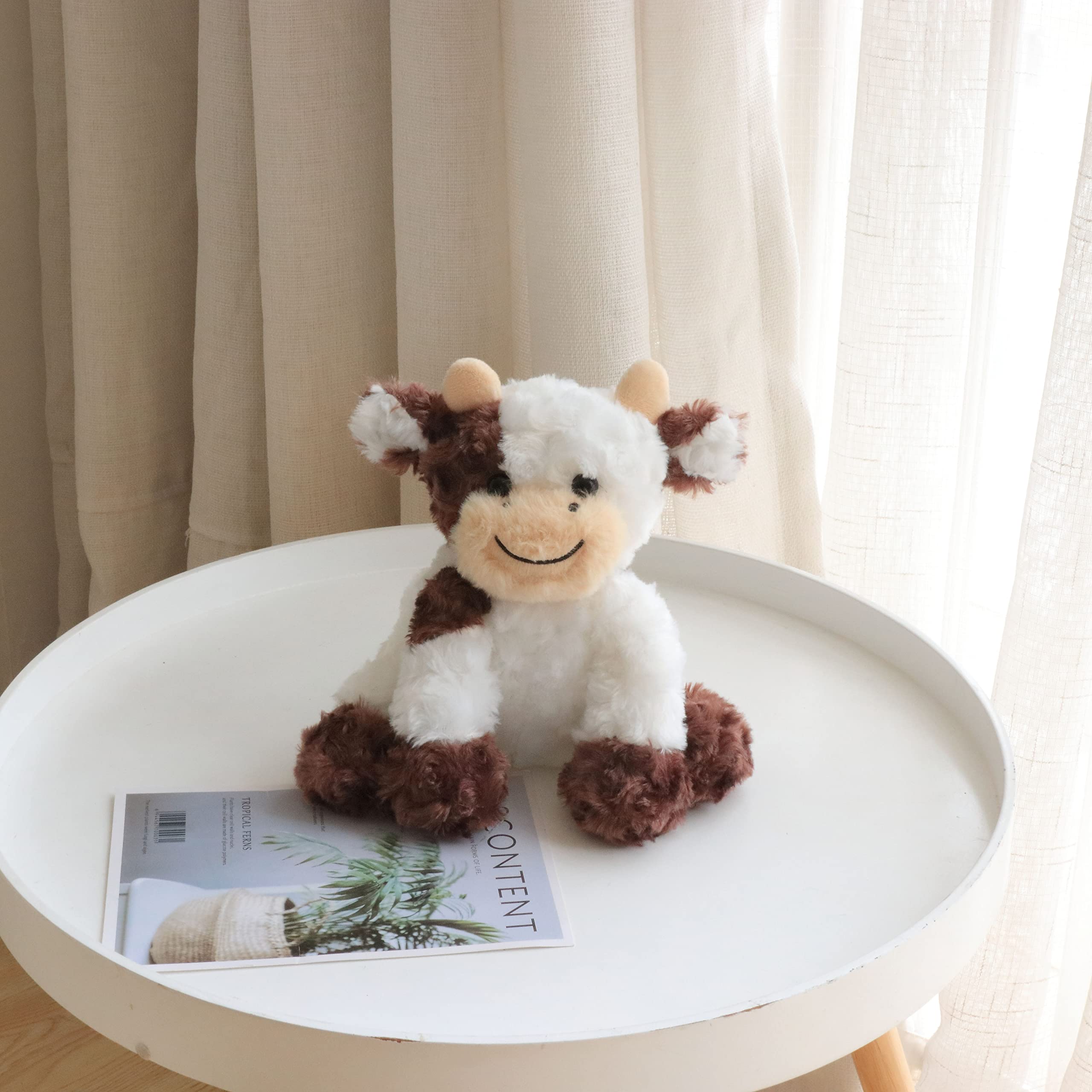 Hopearl soft cow toy fits easily in small hands for travel.