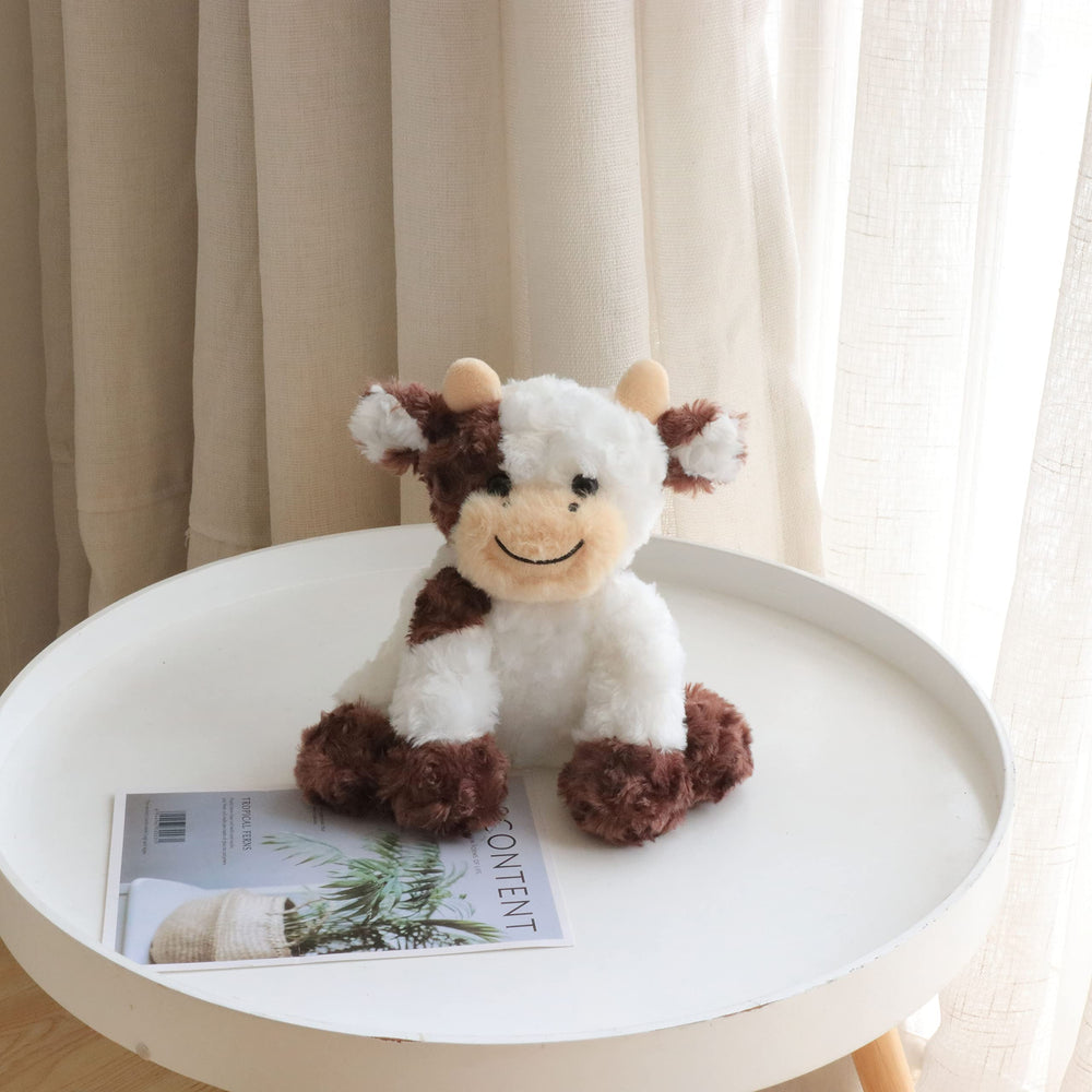 Hopearl soft cow toy fits easily in small hands for travel.